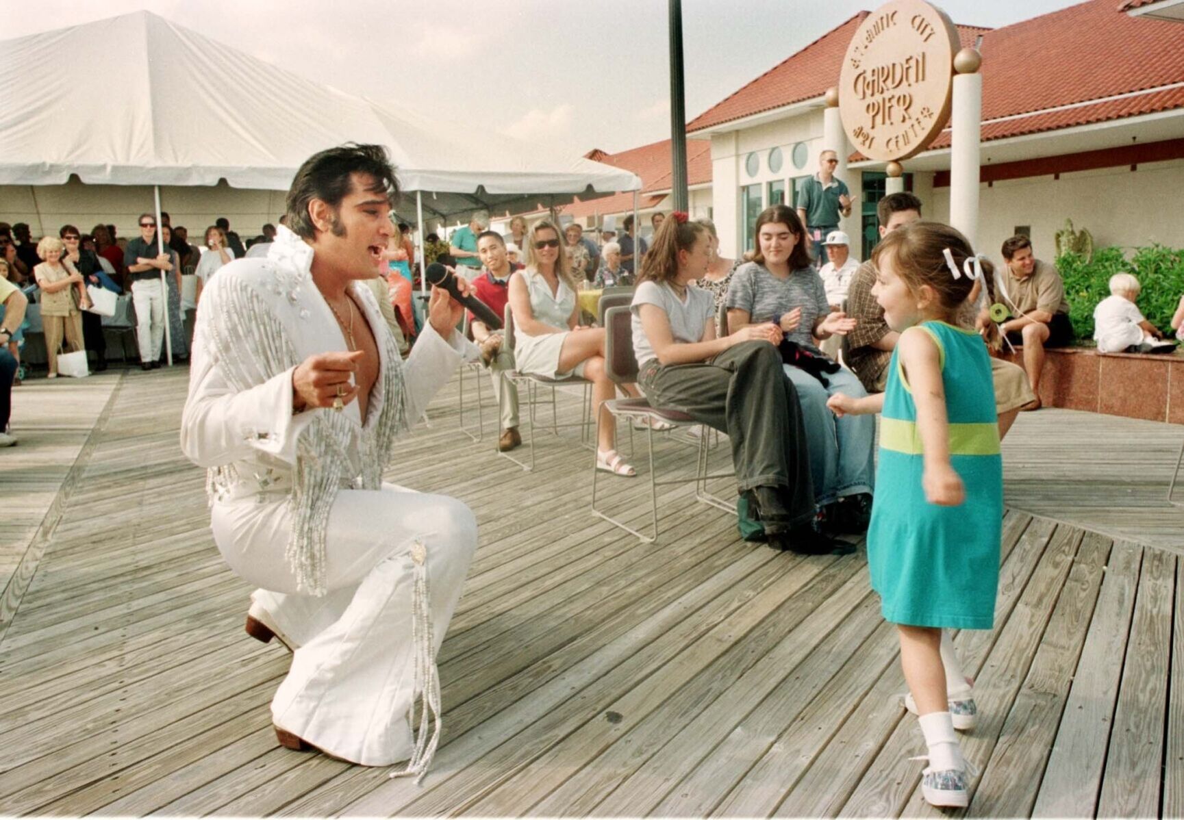 Keri Leigh Gallagher, 5, of Brigantine, shakes, rattles and rolls with ÒElvisÓ, Tony Roi, from the Legends in Concert show, during entertainment at the Best of the Shore Party at Garden Pier Sunday afternoon, 6/14/98.